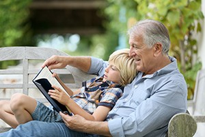 Grandfather Reading to Child