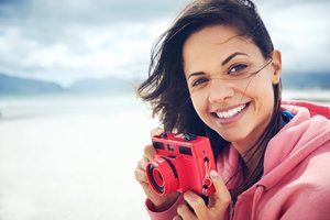 Woman Holding a Camera