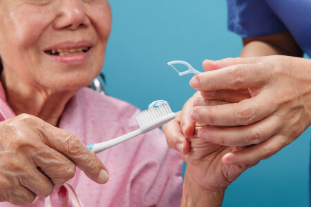 Senior Brushing Teeth