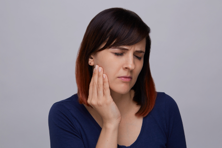 Young Woman with Jaw Pain