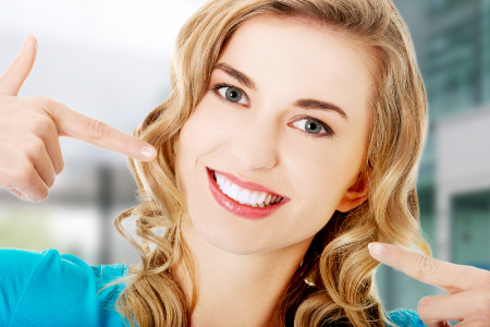 Woman Showing Porcelain Veneers