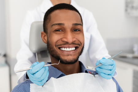 Man Smiling at Dental Checkup