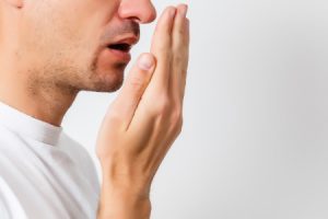 Young Man Checking for Bad Breath